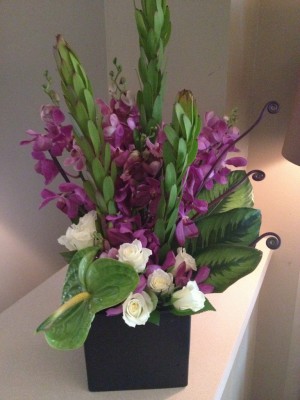 Sympathy arrangement - orchid, tropicals, roses ($120)