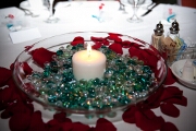 Glass beads, petals, candle