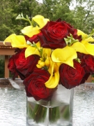 Red roses and yellow calla lilies