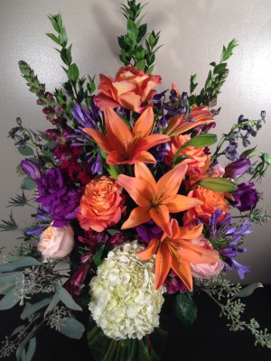 Hydrangea, roses, lilies, agapanthus, sea holly, seeded eucalyptus ($120)