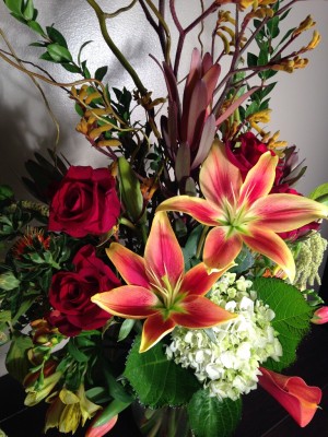 Roses, Asiatic lilies, hydrangea, and leucadendron