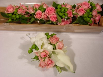 White calla lily, pink spray rose corsage and boutonnieres