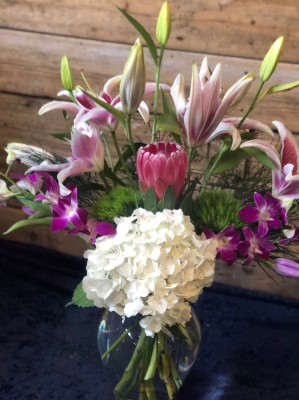 Hydrangea, Asiatic Lily, orchid, protea ($75)