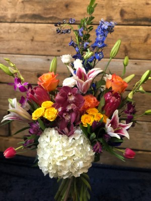 Hydrangea, Protea, Orchid, Delphinium, Tulips, Lilies, Roses