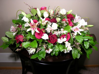Casket flowers ($300)
