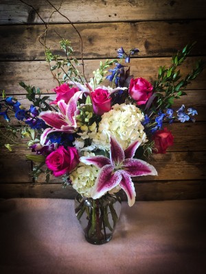 Lily, hydrangea, rose, delphinium, snap dragon ($100)