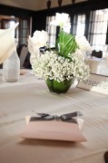 Centerpiece - baby's breath, rose, Ti leaves