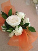 White spray roses, orange ribbon