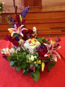 Urn wreath of roses, lilies, stock, gladiolas ($175)