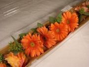 Mango gerbera daisy boutonnieres