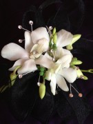 White orchids corsage, with black ribbon, and bling