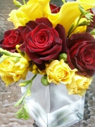 Red roses and yellow calla lilies