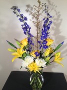 Lilies, delphinium, spider mums