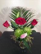 Roses, spider mums, lilies, palm frond