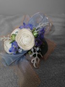 Wrist corsage with white ranunculus