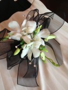 White orchid and black ribbon wristlet