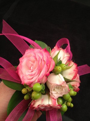Pink rose wrist corsage with hypericum