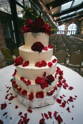 Cake with red roses and petals