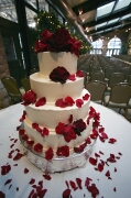 Cake with red roses and petals