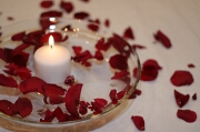 Bowl with floating candle and rose petals